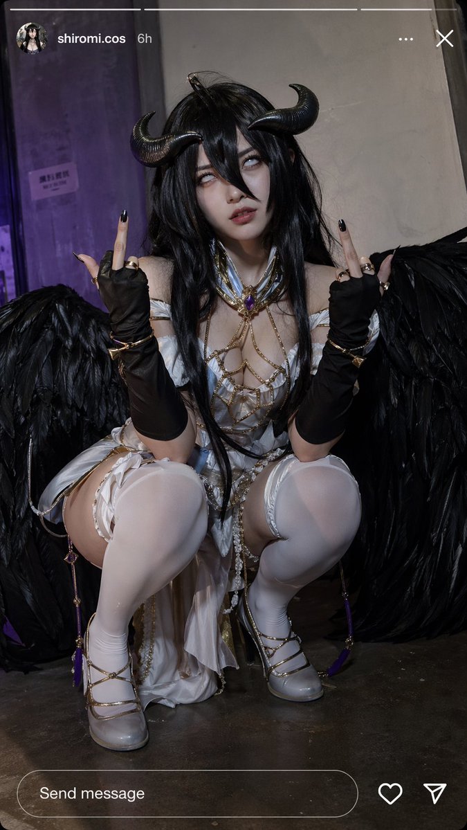 Squatting on the ground, looking directly at the camera