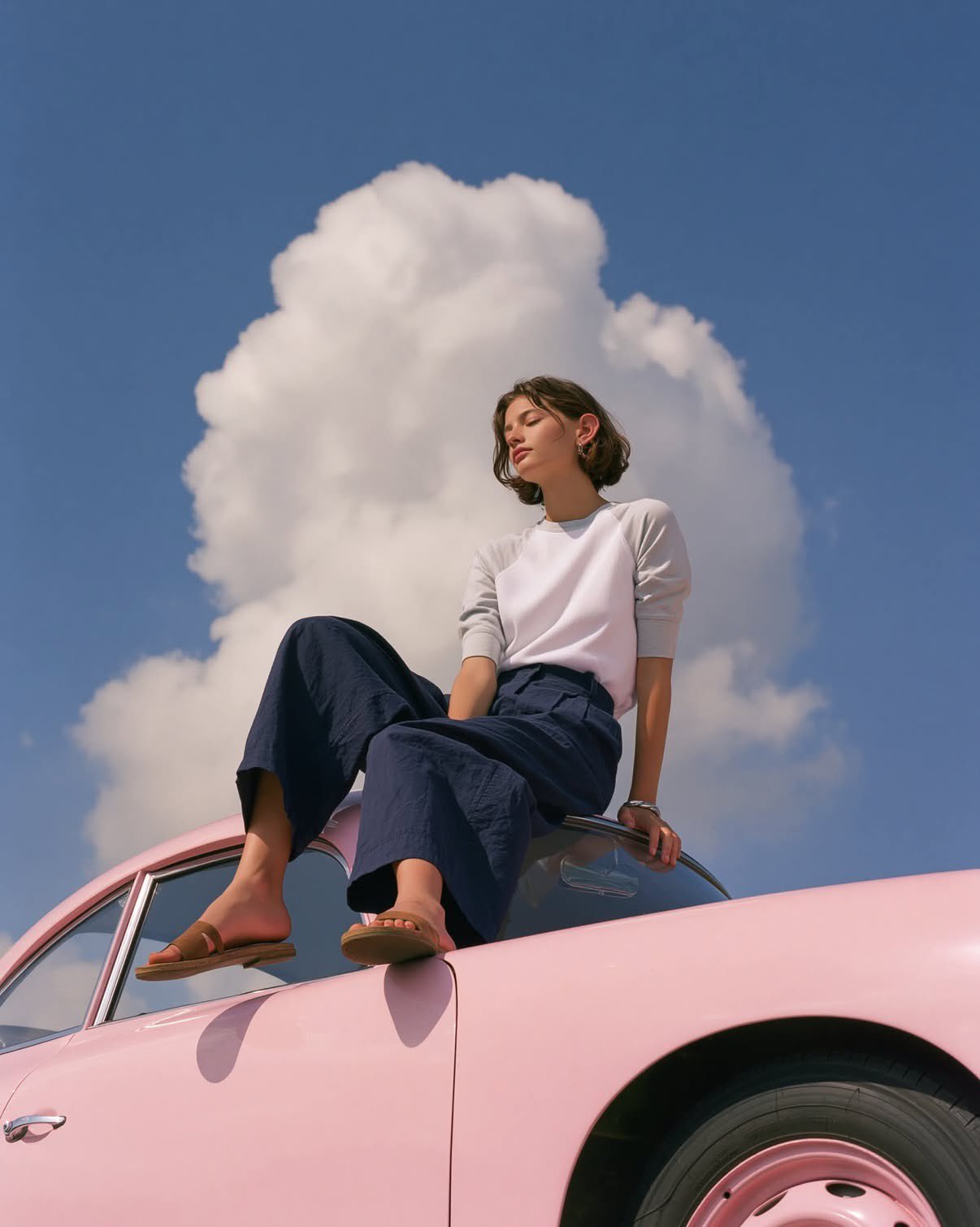 Dreamy fashion photography: the seated pose of a minimalist young woman